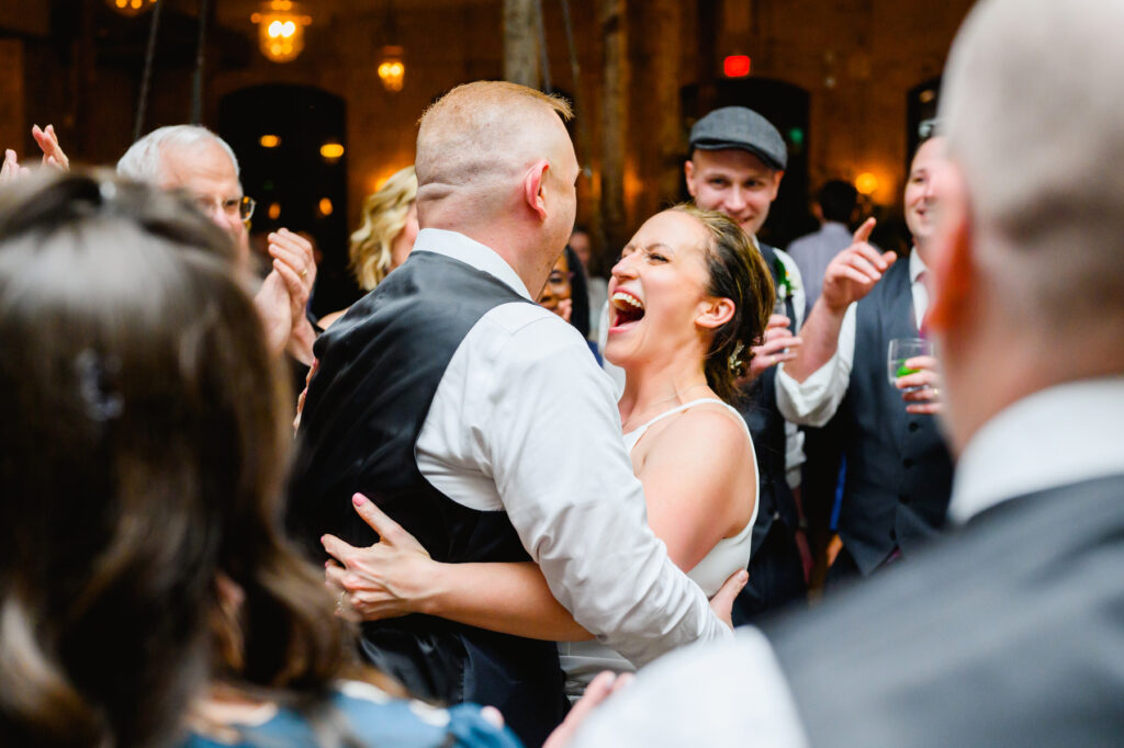 Cedar Room wedding with the couple at reception for the last dance surrounded by friends and family