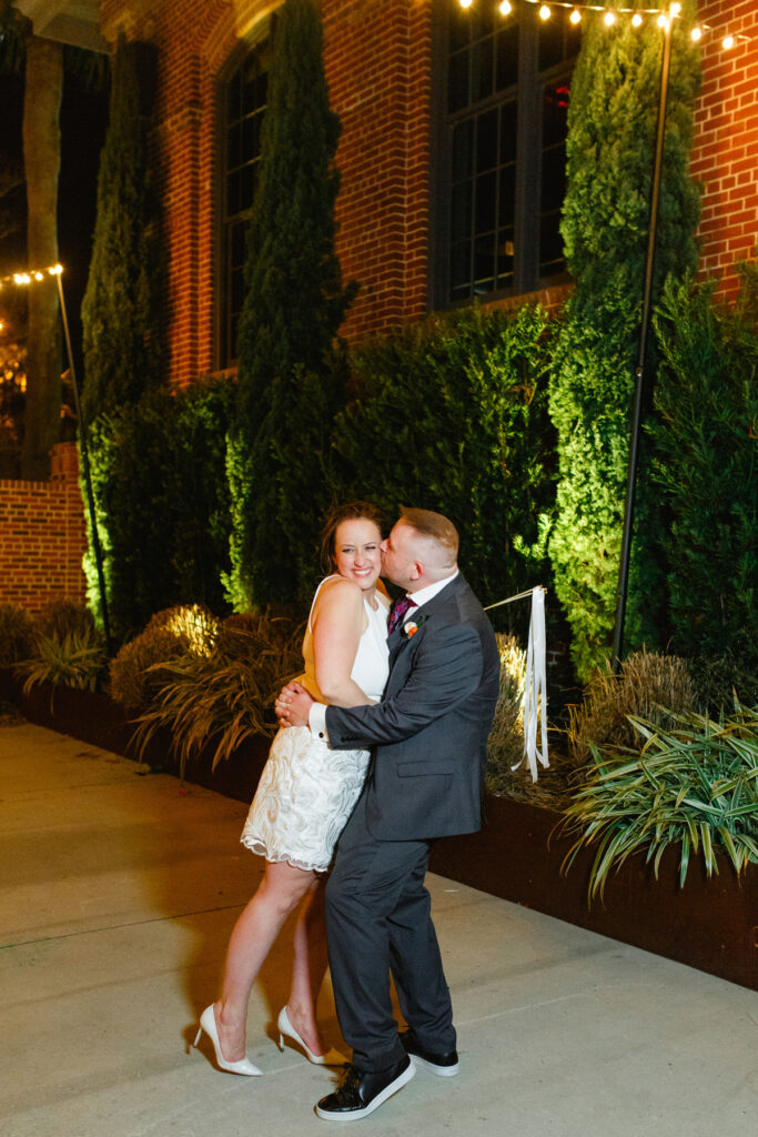 Cedar Room wedding portrait of the newlywed couple in the courtyard at night