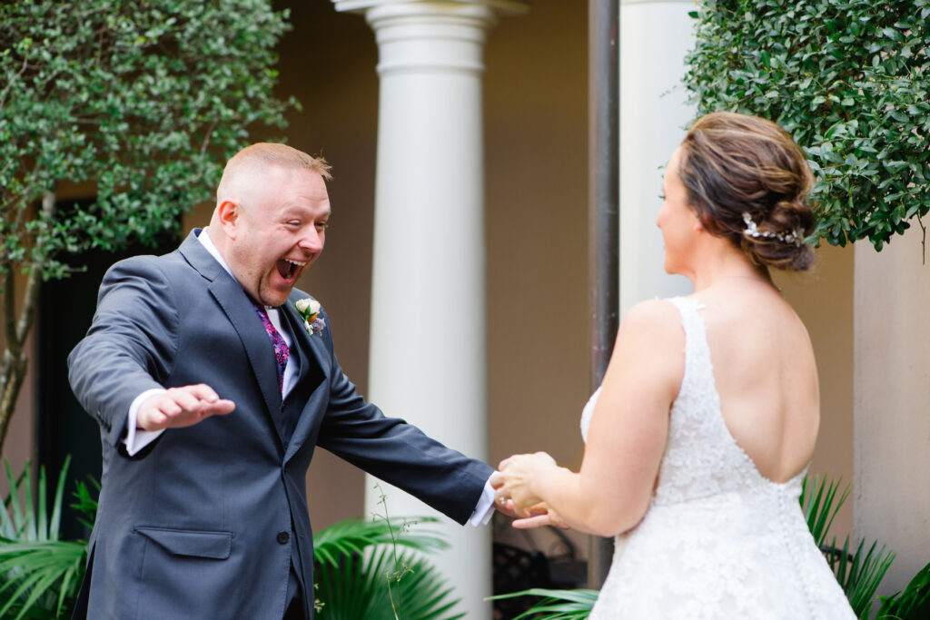 Cedar Room wedding photo of the groom's reaction during the couple's first look