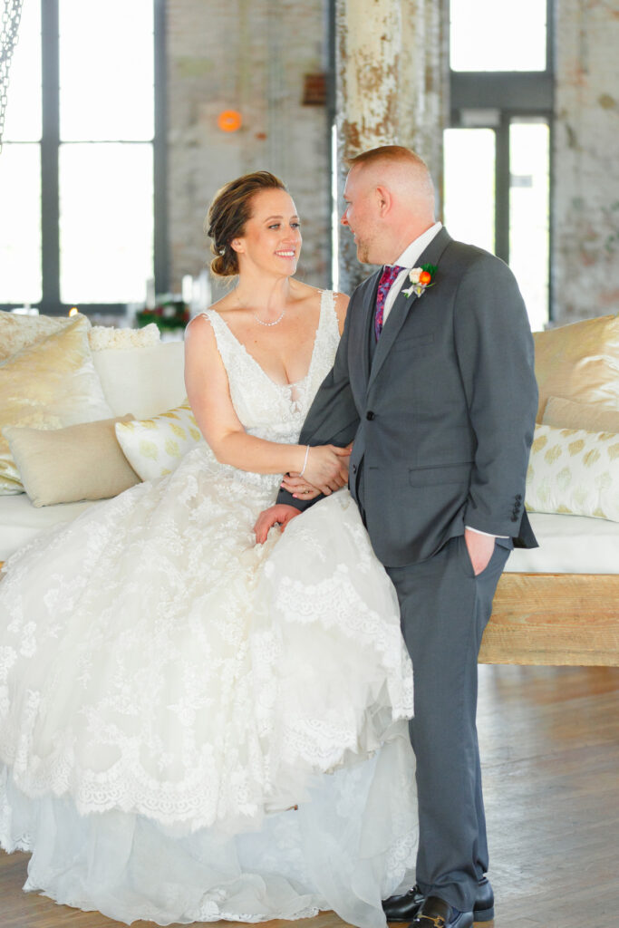 Cedar Room wedding portrait of bride and groom on the swing