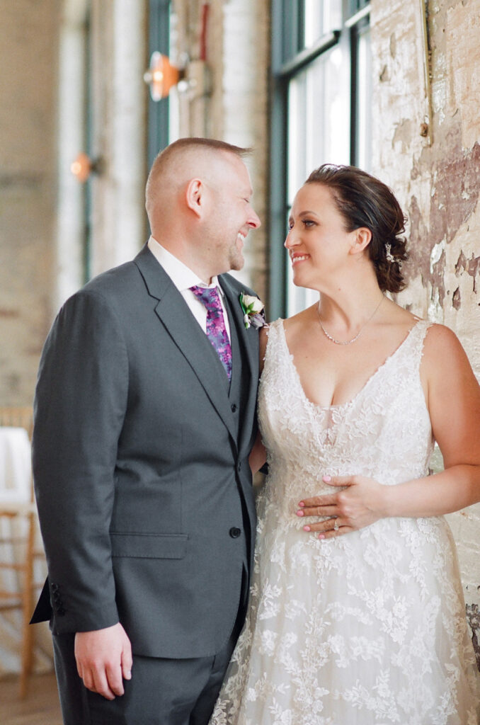 Cedar Room wedding portrait of bride and groom with exposed brick in the background