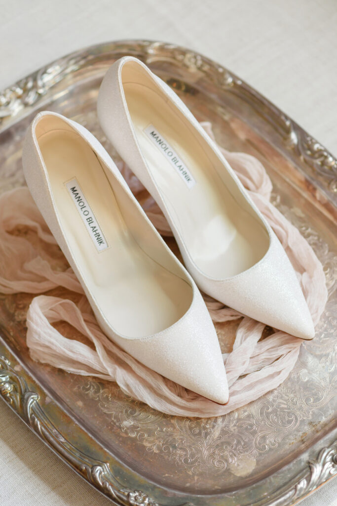 Cedar Room wedding photo of the Manolo Blahnik bridal shoes at the St Philip Suite at Planter's Inn Hotel