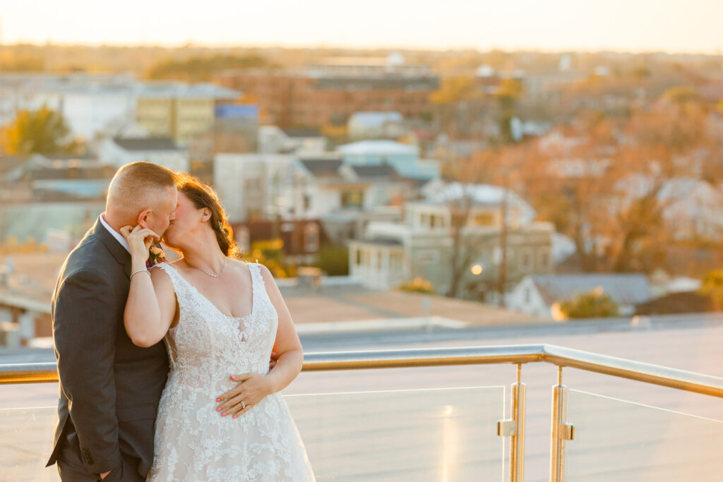 Cedar Room wedding rooftop portrait at sunset with couple kissing