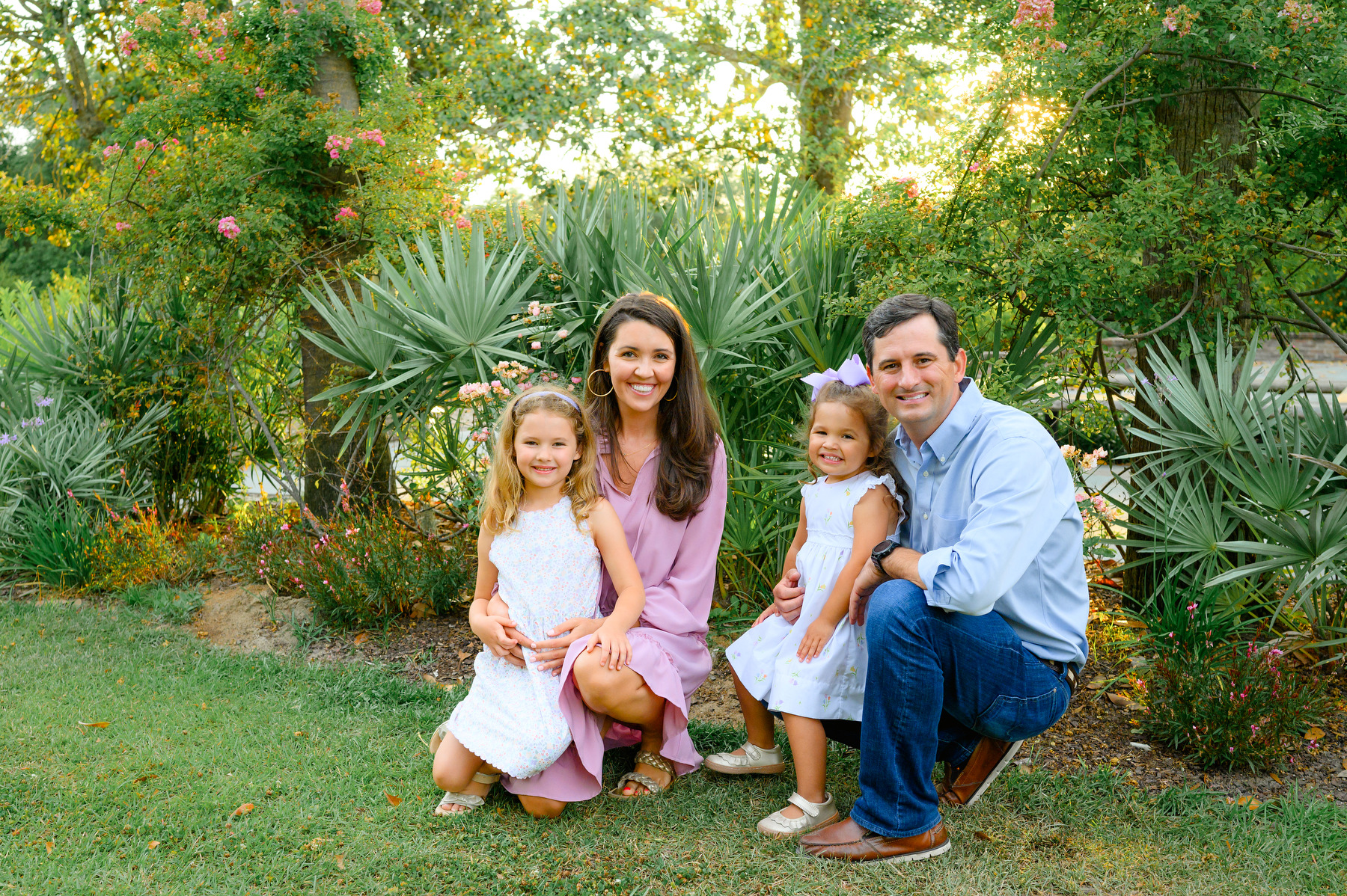 Family photography at Hampton Park with a mom and dad with their two daughters