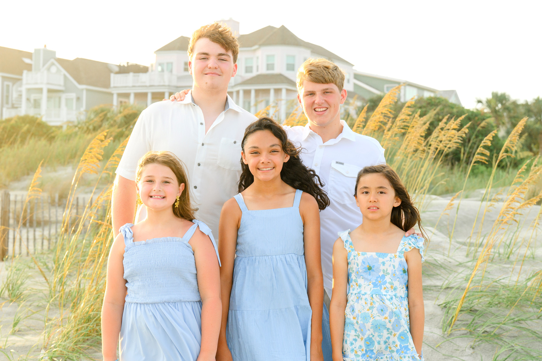 Wild Dunes Family photos grandchildren posing by sand dunes