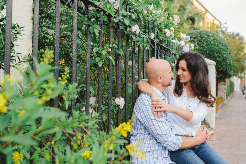 College of Charleston engagement session with man in white pinstriped shirt and woman in white shirt and blue jeans