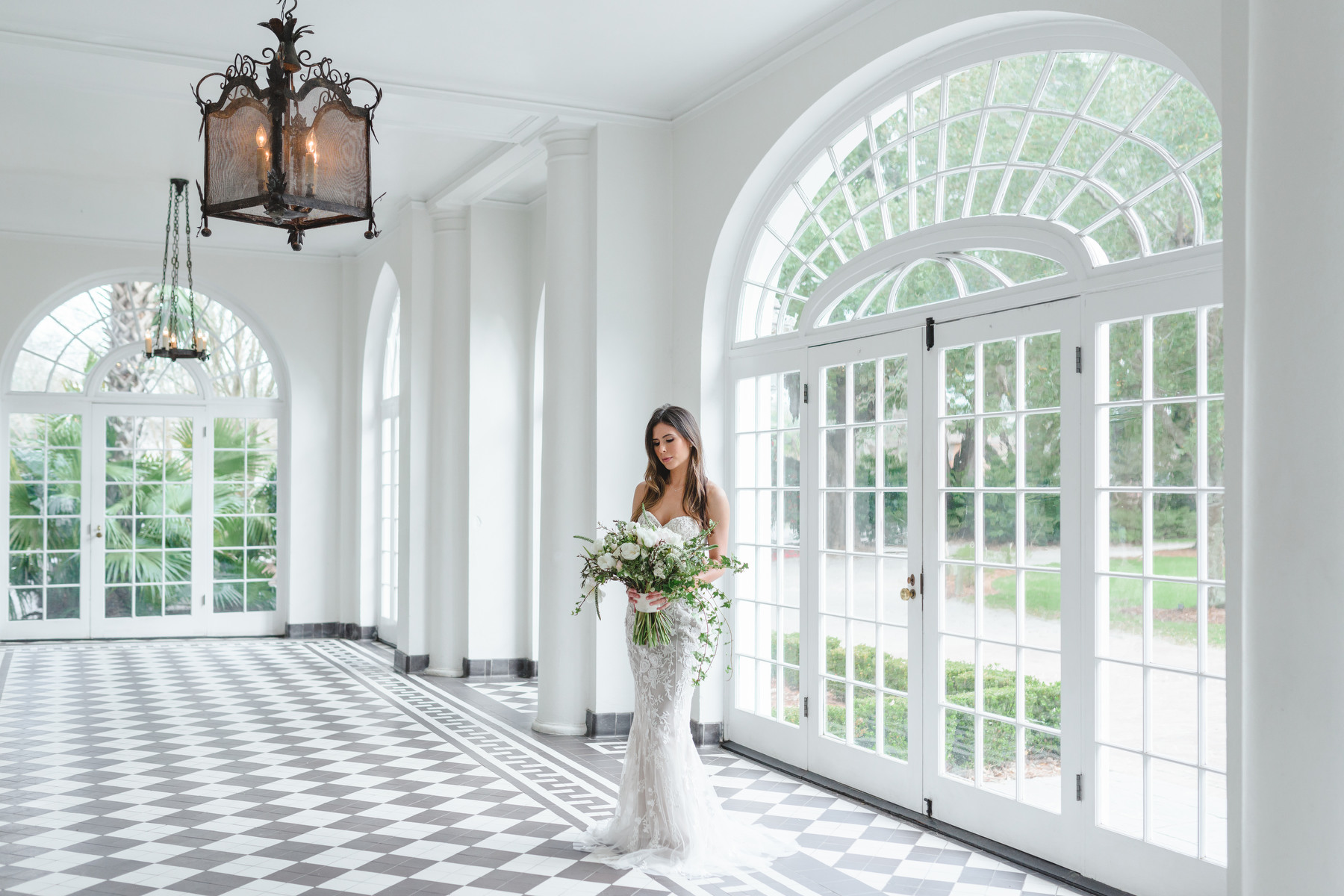 A bride poses for a portrait in Lowndes Grove bridal photos in Charleston, SC.