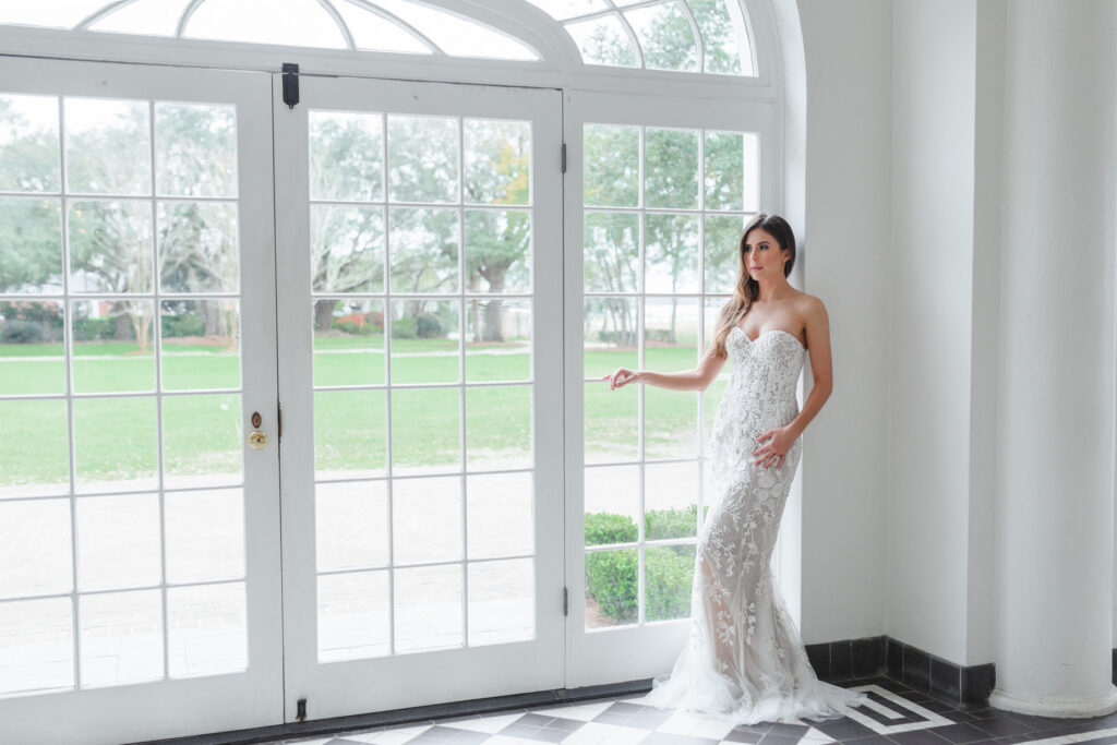 A bride poses for a portrait in Lowndes Grove bridal photos in Charleston, SC.