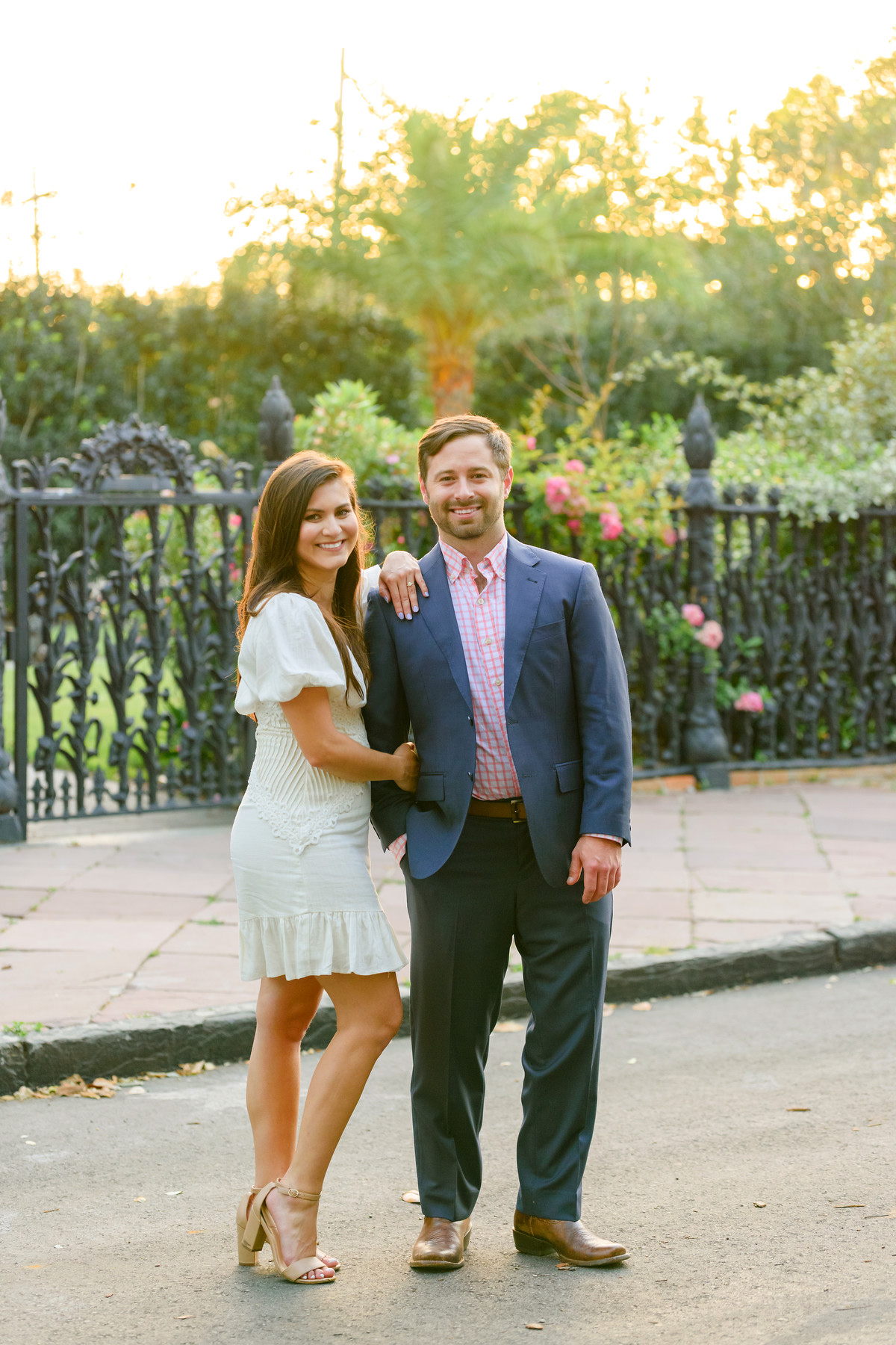 A woman and a man pose for a photo during their New Orleans engagement photos session.