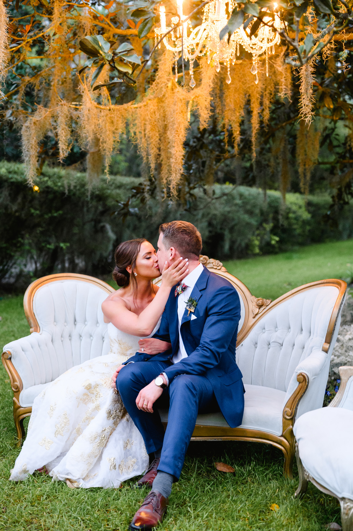 A bride and groom kiss at a Veranda Magnolia Gardens wedding in Charleston, SC.