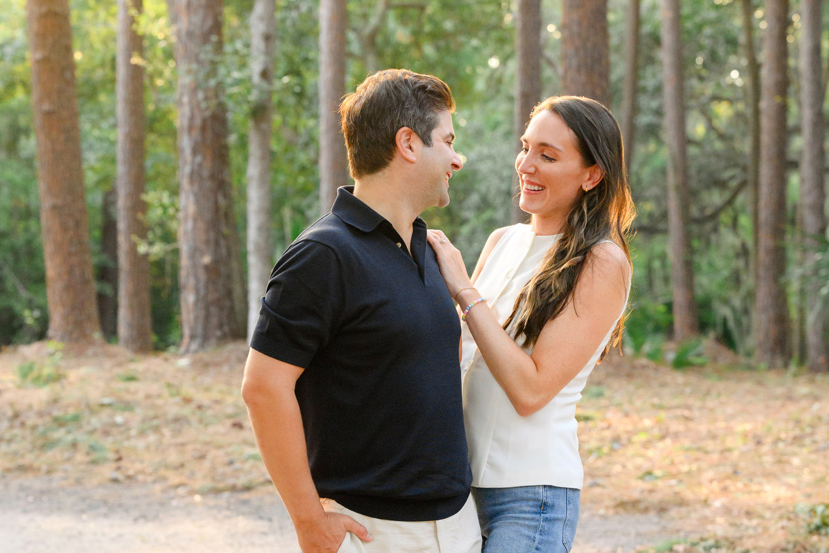 A man and woman pose for a photo during their Sea Pines engagement session.