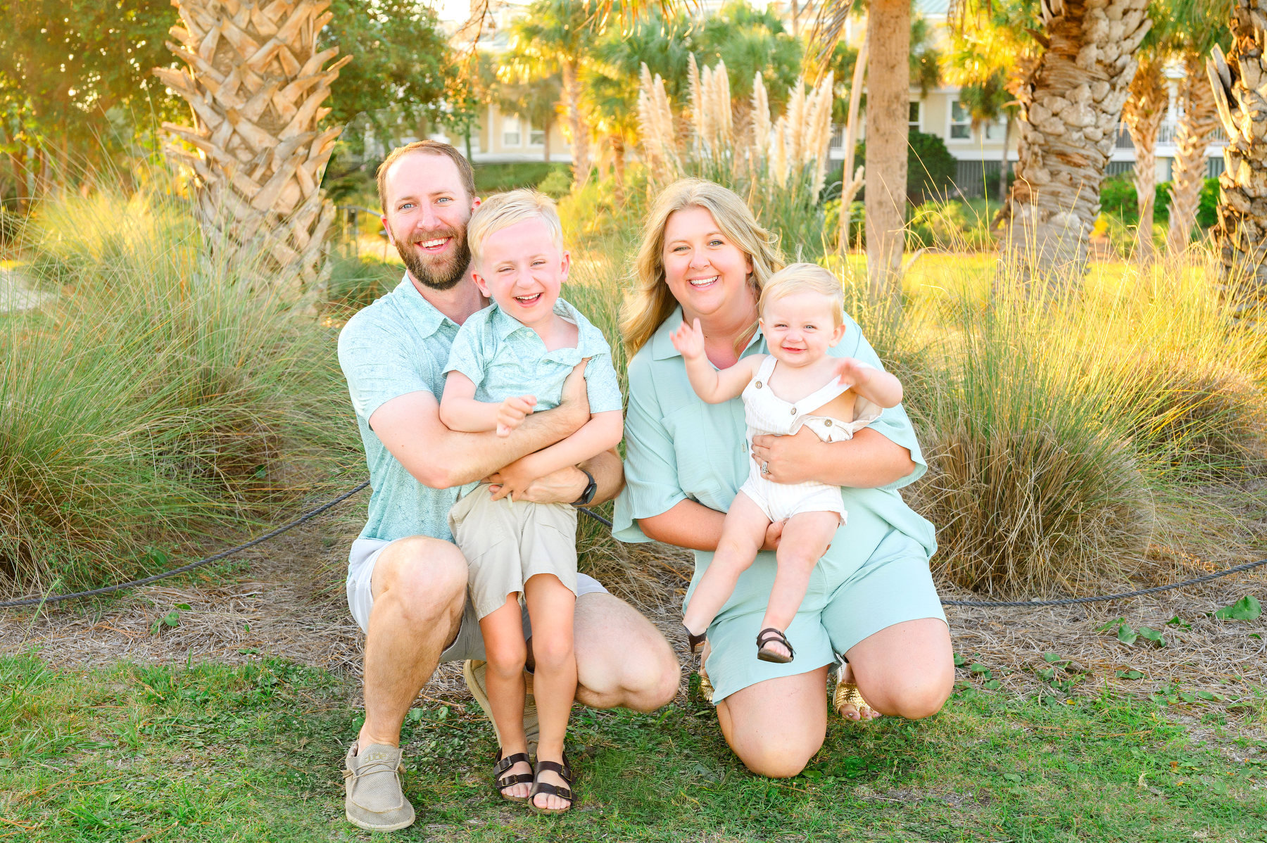Professional pictures during Seabrook Island family photos on the beach. Family is a mom, dad, a toddler, and a baby.